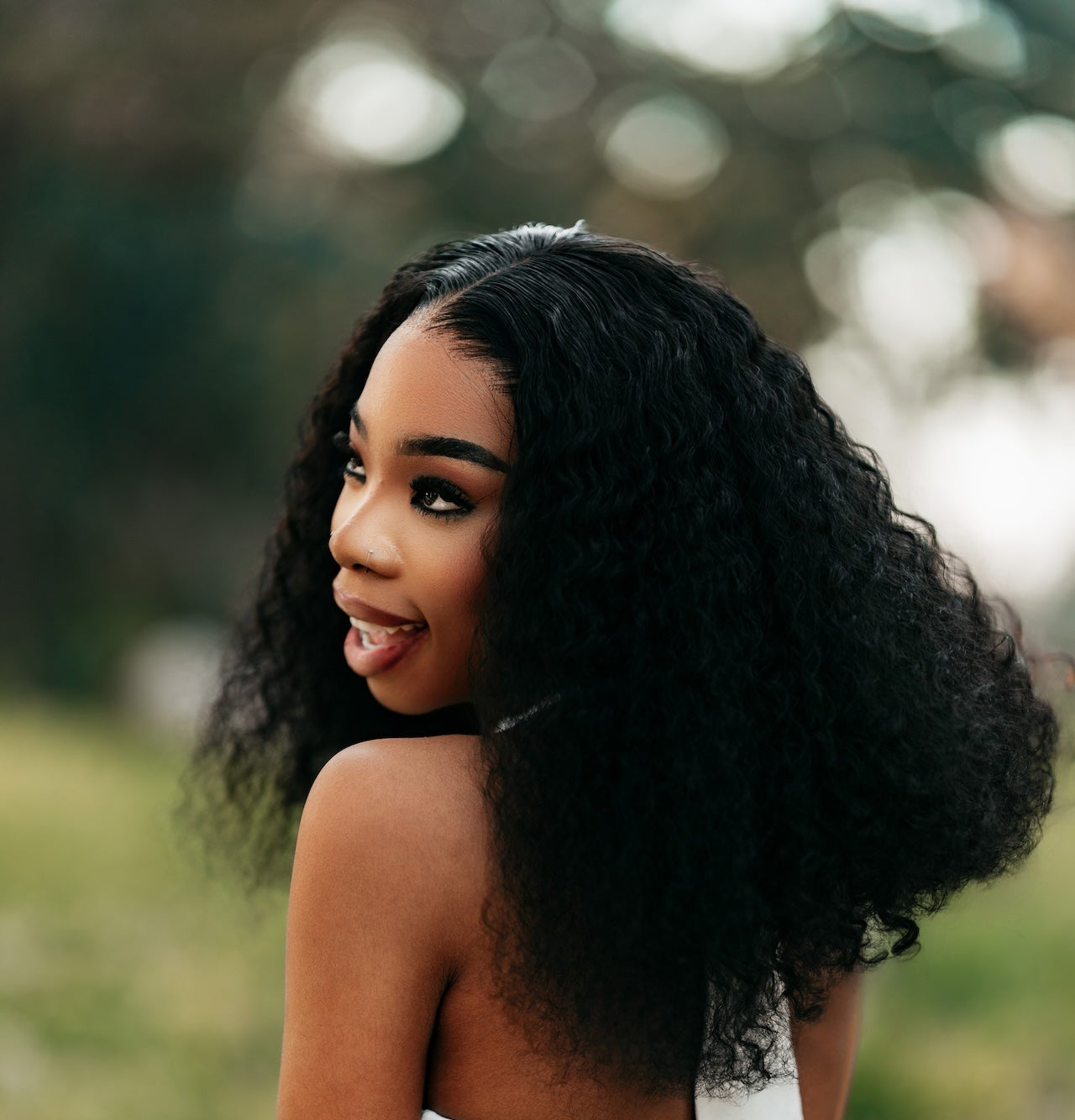 Woman with voluminous curly hair.